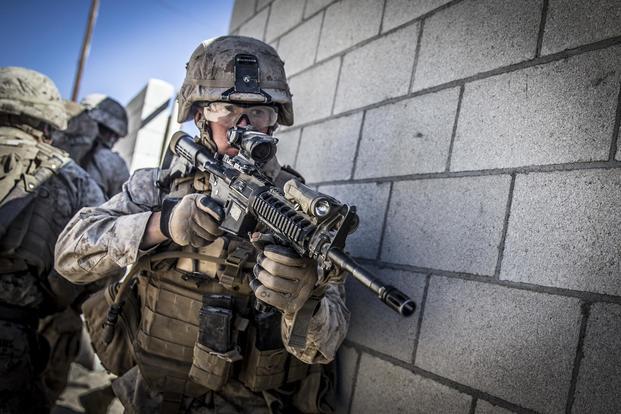 Lance Cpl. Bailey Behunin, a rifleman with the 11th Marine Expeditionary Unit, provides rear security while conducting an urban platoon assault during an exercise at Marine Corps Air Ground Combat Center Twentynine Palms, Calif., Nov. 12, 2018. (U.S. Marine Corps/Lance Cpl. Dalton S. Swanbeck)