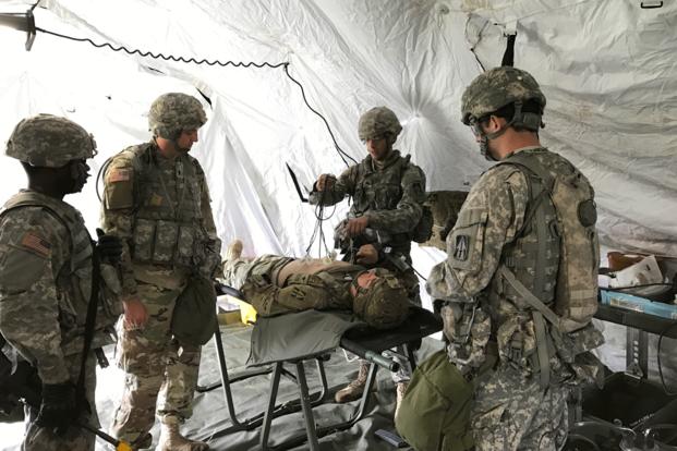 Charlie Med, C Company, 113th Brigade Sustainment Battalion, 76th Infantry Brigade Combat Team Soldiers maintain their skills by training how to administer an EKG during the Spring Field Training Exercise in preparation for Joint Readiness Training Center rotation, #JRTC. (U.S. Army photo/Chris Matthews)