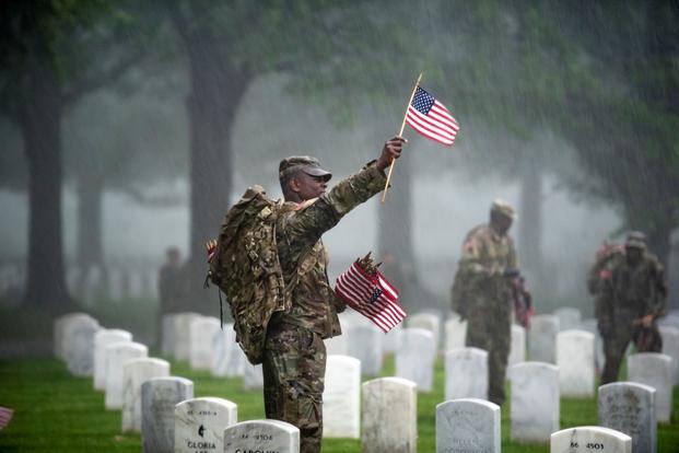Soldiers from the 3d U.S. Infantry Regiment (The Old Guard) place U.S. flags at headstones as part of Flags-In at Arlington National Cemetery, Arlington, Virginia, May 23, 2019. For more than 55 years, soldiers from the Old Guard have honored our nation’s fallen heroes by placing U.S. flags at gravesites for service members buried at both Arlington National Cemetery and the U.S. Soldiers’ and Airmen’s Home National Cemetery just prior to the Memorial Day weekend. Within four hours, more than 1,000 soldiers 