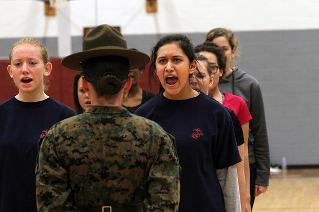Female poolees from Marine Corps Recruiting Station Columbia respond to Sgt. Stevie Cardona, drill instructor for Oscar Company, 4th Recruit Training Battalion, at Marine Corps Recruit Depot Parris Island, during the semiannual Female Pool Function on Fort Jackson on Jan. 24, 2015. Cpl. Tabitha Bartley/Marine Corps