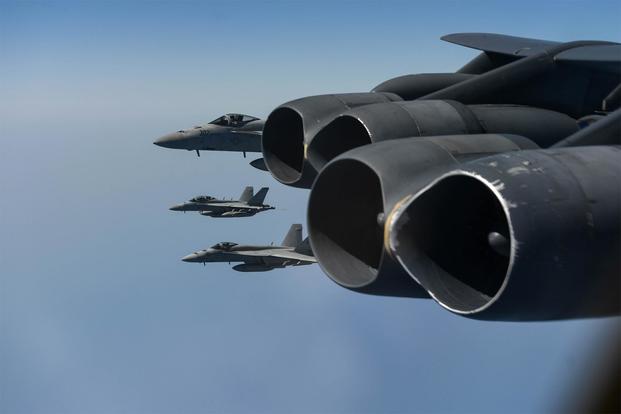 Abraham Lincoln Carrier Strike Group and a U.S. Air Force B-52H Stratofortress conduct joint exercises in the U.S. Central Command area of responsibility. (U.S. Navy/Mass Communication Specialist 3rd Class Amber Smalley)