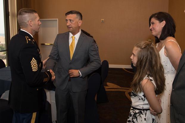 Former U.S. Army Staff Sgt. David G. Bellavia (second from left) attends a Medal of Honor reception at the Sheraton Pentagon City Hotel, Arlington VA, June 24, 2019 (U.S. Army/Sgt. Kevin Roy)
