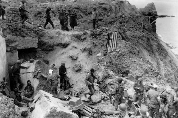 They climbed 100-foot cliffs under fire to take out key German artillery pieces aimed at the beaches. (Photo: The National WWII Museum)