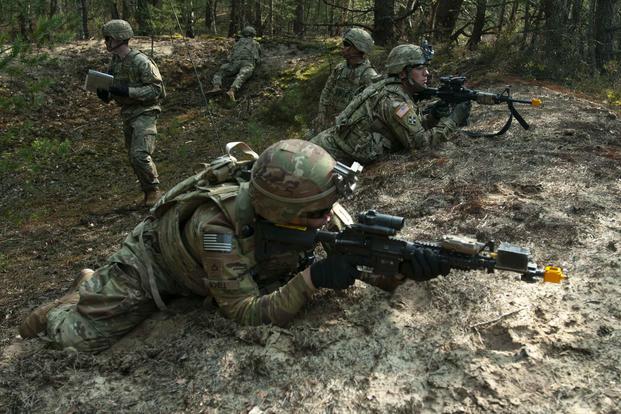 Cavalry scouts assigned to 1st Platoon, Bravo Company, 1st Squadron, 4th Cavalry Regiment, 1st Armored Brigade Combat Team, use the Polish terrain to hone their skills while executing area reconnaissance during a recent training exercise in Swietoszow, Poland, in April 2019. Sgt. Kris Wright/Army