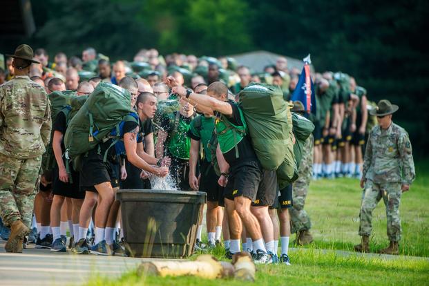 Soldiers at Fort Benning training to become infantrymen make use of immersion troughs filled with ice and water, allowing troops a quick way to cool their bodies during rigorous training in the Georgia heat in July 2018. The troughs are just one of the measures used to help avoid heat injuries. (U.S. Army photo by Patrick A. Albright, Fort Benning Maneuver Center of Excellence)