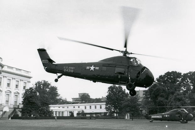 This photograph by Warren K. Leffler, of the U.S. News and World Report, shows a helicopter carrying President Dwight D. Eisenhower leaving the White House for Gettysburg, Pennsylvania on May 20, 1958. The East Wing of the White House is visible in the background. President Eisenhower was the first president to use helicopters regularly for presidential transportation. (White House Historical Association)