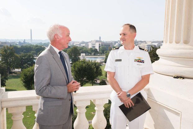 Lt. Cmdr. Jonathan Cebik is promoted at the U.S. Capitol in 2016. He was relieved from his post Aug. 20, 2019. (Rep. Joe Courtney's office via Facebook)