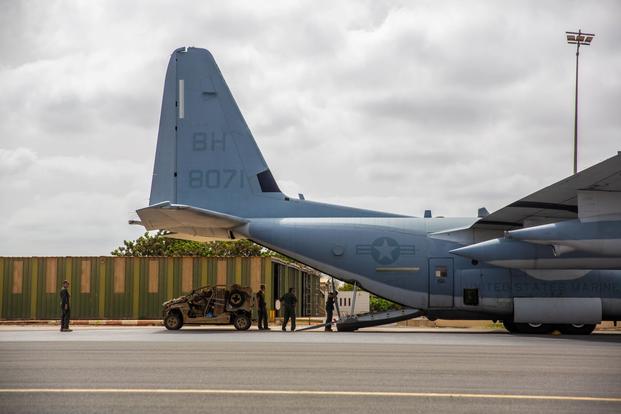 A U.S. Air Force para-rescueman with Special Purpose Marine Air-Ground Task Force-Crisis Response-Africa 19.2, Marine Forces Europe and Africa, loads a utility- terrain vehicle on a U.S. Marine Corps KC-130J Super Hercules in Dakar, Senegal, Aug. 6, 2019. SPMAGTF-CR-AF 19.2 rehearsed embassy reinforcement procedures at U.S. Embassy Bamako, Mali. SPMAGTF-CR-AF is deployed to conduct crisis-response and theater-security operations in Africa and promote regional stability by conducting military-to-military tra