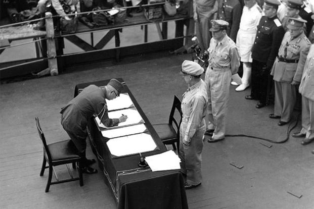 Gen. Umezu signs instrument of surrender on Sept. 2, 1945. (U.S. Department of Defense)