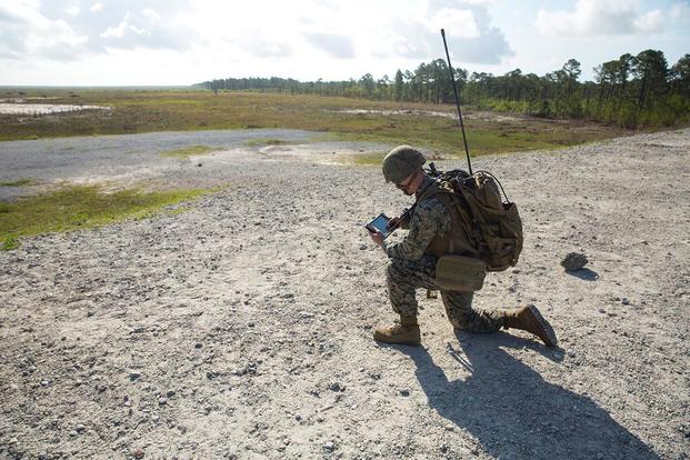 A Marine looks at a digital map on a Target Handoff System version 2.0 during a Marine Corps Combat Readiness Evaluation at Camp Lejeune, N.C., April 20, 2017. (U.S. Marine Corps photo)