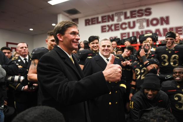 Secretary of the Army, Mark T. Esper, congradulates the West Point football team at the 119th Army-Navy Game in Philadelphia, Pa., Dec. 8, 2018. The Army defeated the Navy for their third year in a row. (U.S. Army/Spc. Dana Clarke)
