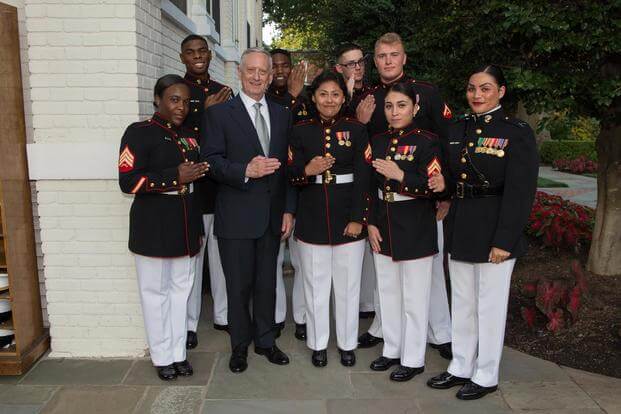 Defense Secretary Jim Mattis stands with Marines before a sunset parade at the Marine Barracks Washington in Arlington, Va., June 30, 2017. (DoD/U.S. Army Sgt. Amber I. Smith)