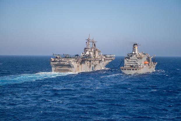 The amphibious assault ship USS Boxer (LHD 4), left, conducts a replenishment-at-sea with the fleet replenishment oiler USNS Tippecanoe, Sept. 6, 2019. (T-AO 199 (U.S. Navy/Mass Communication Specialist 3rd Class Danielle A. Baker)
