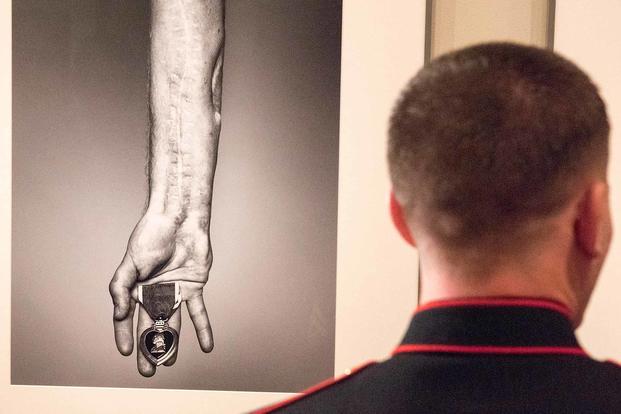 U.S. Marine Cpl. Kyle Carpenter observes his portrait at the National Portrait Gallery in Washington, D.C., on Nov. 15, 2015. Carpenter is the youngest living Medal of Honor recipient. (DoD photo by D. Myles Cullen)