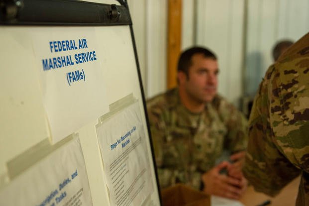 Soldiers attend a career fair.
