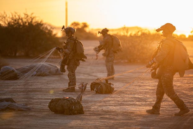 Army Special Forces soldiers retrieve parachutes at Tunnel Drop Zone