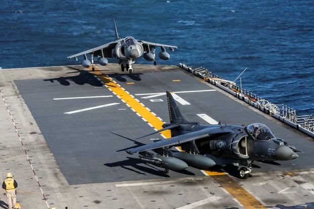 Marine Corps AV-8B Harriers land on the USS Bataan.