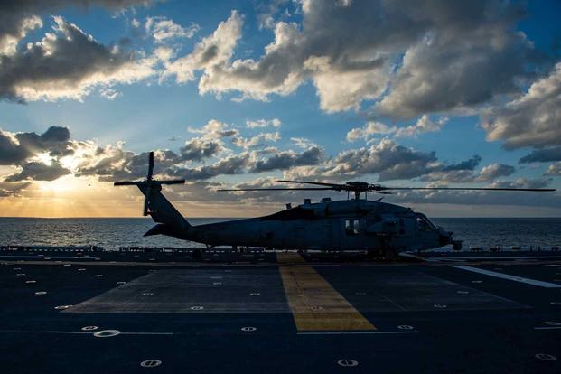 An MH-60S Sea Hawk helicopter on the flight deck of the USS America.
