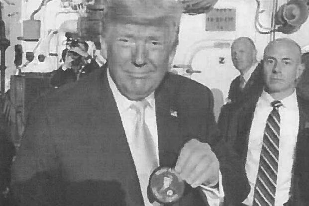 Trump holding MAGA patch (U.S. Navy)