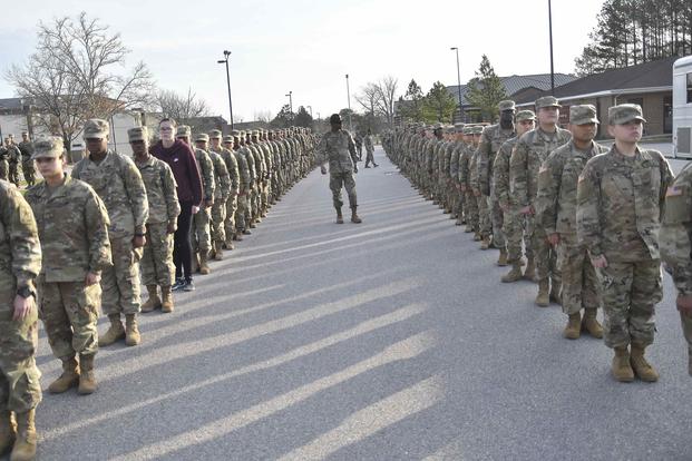 Drill sergeants look over troops before proceeding to classrooms near the Soldier Support Center.