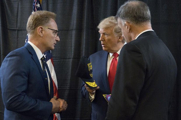 Acting Navy Secretary Thomas Modly speaks with President Donald Trump