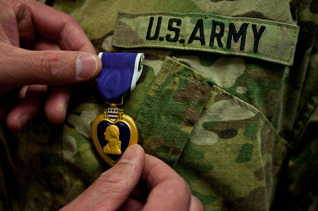The Purple Heart, the oldest American military decoration for military merit, is awarded to members of the U.S. armed forces who have been killed or wounded in action against an enemy. It is also awarded to soldiers who have suffered maltreatment as prisoners of war. Purple Heart day is dedicated to honoring service members, past and present, who have received the Purple Heart medal. (Sgt. Michael Selvege/U.S. Army)