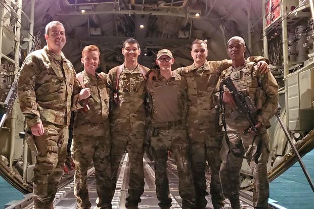 An aircrew assigned to the 774th Expeditionary Airlift Squadron poses for a group photo in Afghanistan, Sept. 2019. 