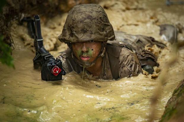 A Marine officer candidate participates in the OCS combat course at  Quantico.