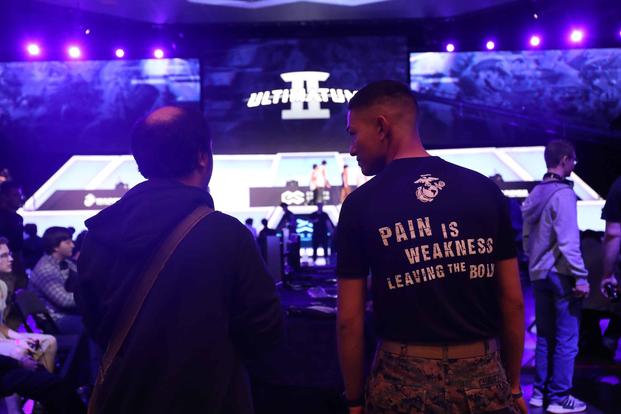A U.S. Marine recruiter converses with an attendee during Ultimatum II, a Smash Ultimate Tournament.