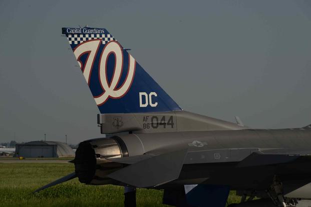 A U.S. Air Force F-16 Falcon with a Washington Nationals logo painted as the tail flash.