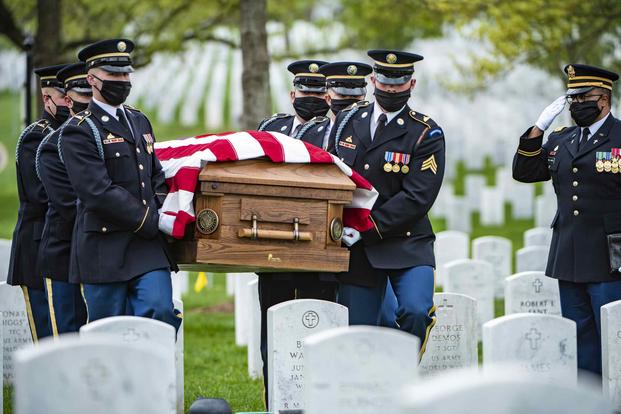 Soldiers conduct modified military funeral honors in Arlington National Cemetery.