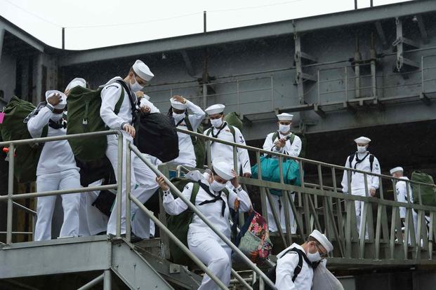 Sailors disembark USS Harry S. Truman (CVN 75) after the ship’s return to Norfolk Naval Station following a seven month deployment.