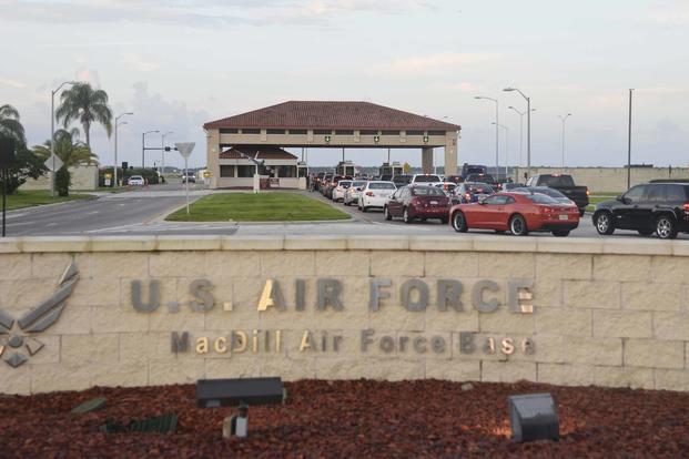 Privately owned vehicles wait to enter through the Dale Mabry gate at MacDill Air Force Base.