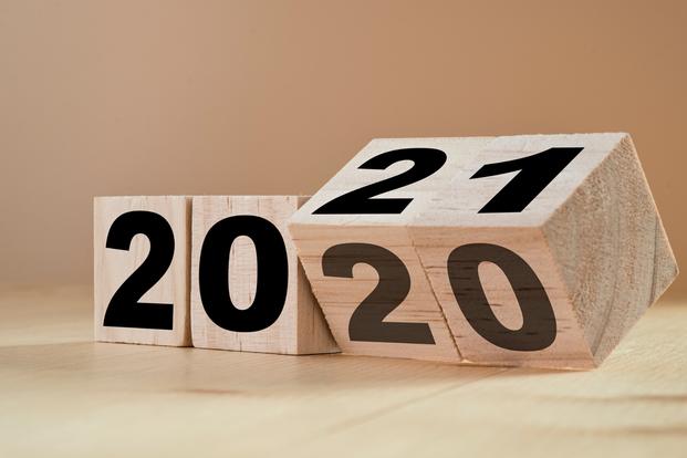 Wooden blocks flipping over to display new year 2021