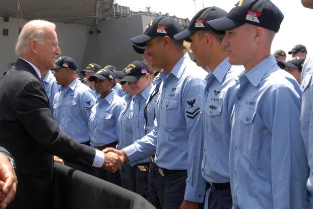 Vice President Joe Biden shakes hands aboard the USS Ronald Reagan.