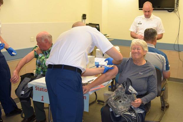 Military retirees receive their yearly flu vaccination.