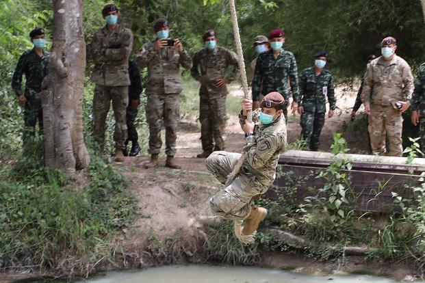 The 5th SFAB works an obstacle course with the Royal Thai Army
