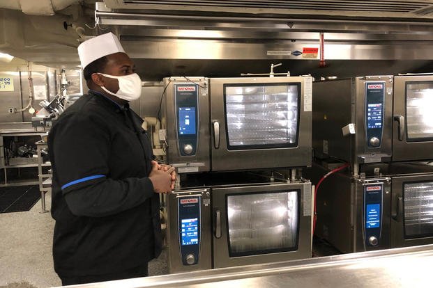 Culinary Specialist First Class Trevorn McKnight shows off the carrier Gerald R. Ford's new convection ovens Nov. 17, 2020 (Hope Hodge Seck/Staff)