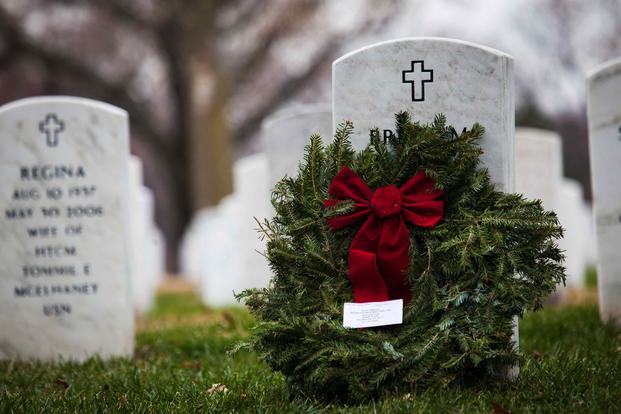 A wreath is laid across a grave at Arlington National Cemetery in Arlington, Virginia, on Dec. 14, 2013.