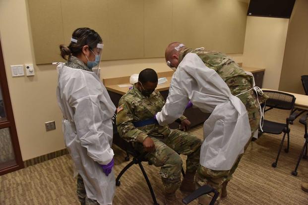 Soldiers train to assist with staffing shortages due to COVID-19.