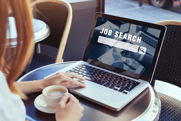 Woman searching for a job online