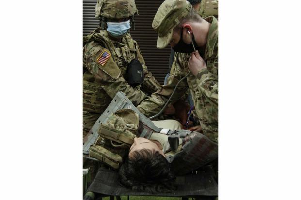 Medics at Fort Stewart, Georgia, test a new female combat trauma mannequin