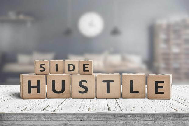 Wooden play blocks spelling out words "Side Hustle"