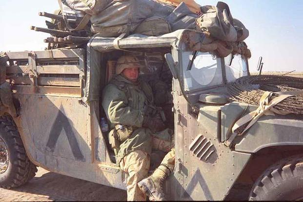 First Lt. Harry L. Whitlock in a Humvee) near Tallil Air Base, Iraq.