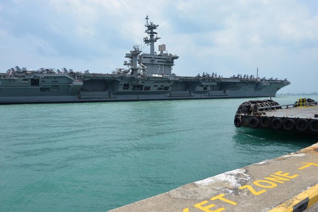aircraft carrier USS Theodore Roosevelt (CVN-71) moored in Singapore’s Changi Naval Base