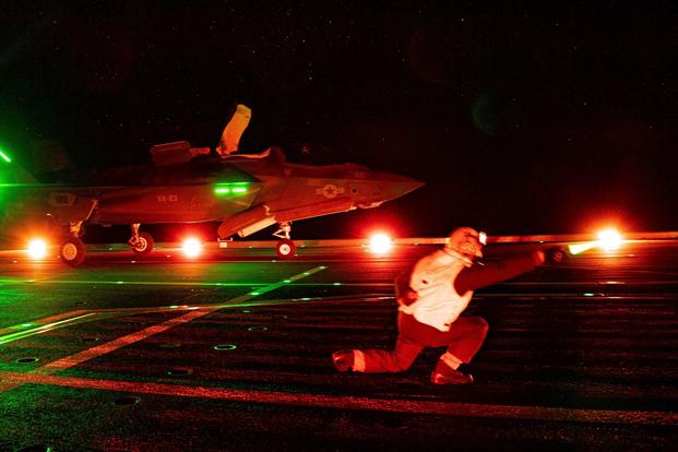 A F-35 test pilot prepares to launch for an evaluation flight aboard ITS Cavour. 