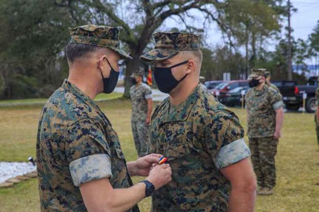Sgt. Danny McDonald receives the Navy and Marine Corps Medal.