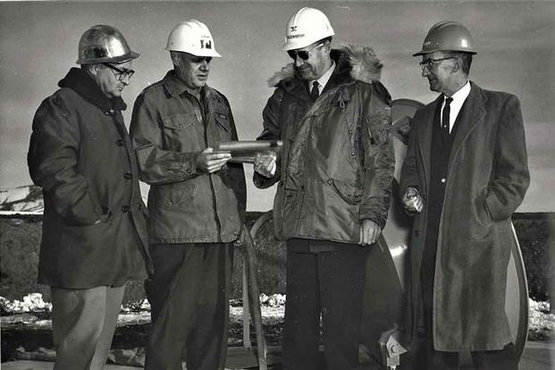 In a ceremony at Malmstrom AFB, Colonel Harry E. Goldsworthy, SATAF commander, accepts a symbol of the first completed Minuteman operational silo from Army Area Engineer Colonel Arthur H. Lahlum, Nov. 13, 1961. (U.S. Air Force) Colonel Harry E. Goldsworthy at ceremony for first completed Minuteman silo.