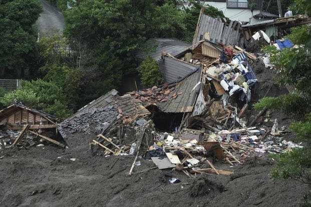 Damaged houses and infrastructures are seen at a mudslide area in Japan.