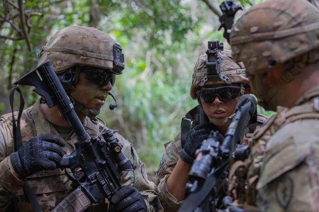 Soldiers talk during live fire exercise training.